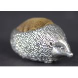 A silver hedgehog pin cushion, Ammonite Ltd, Birmingham 1982, 5.