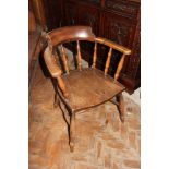 A late 19th century beech, ash and elm desk chair,