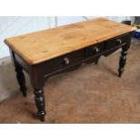 A Victorian pine kitchen table, with three drawers on turned legs,