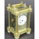 A French gilt brass carriage time piece,