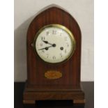 An Edwardian mahogany lancet shaped mantel clock,