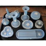 A collection of blue jasper cameo wares, to include; a desk stand, a pair of candlesticks,