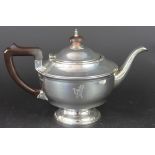 An Art Deco silver teapot, Marson and Jones Birmingham 1933, of pedestal circular form,