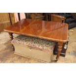 A Victorian mahogany extending dining table, on turned and fluted tapered legs, one spare leaf,