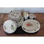 A selection of Kathie Winkle designed Ironstone plates; with a Crown Devon vegetable plate;