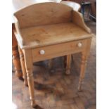 A Victorian pine side table, with drawer on turned legs,