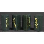 Four Chinese green nephrite gilt scroll weights