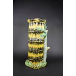 A late 19th century majolica stick stand, modelled as a bound group of bamboo, some chips,