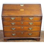 A George III mahogany bureau, with fall over two short and three long drawers on bracket feet,