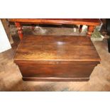 An Edwardian stained pine blanket chest, on plinth base,