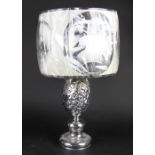 A chrome pineapple table lamp, with Fornasetti shade,