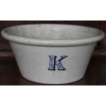 A large 19th century Staffordshire dairy pan, initialled 'K' for kitchen,