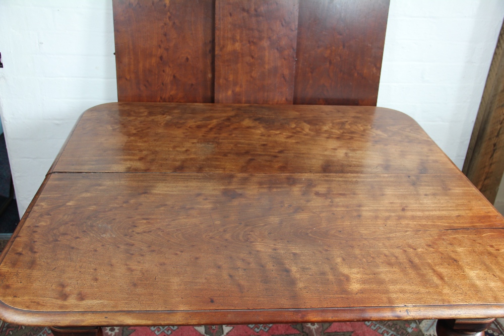 An early Victorian mahogany extending dining table, with three spare leaves, - Image 2 of 3