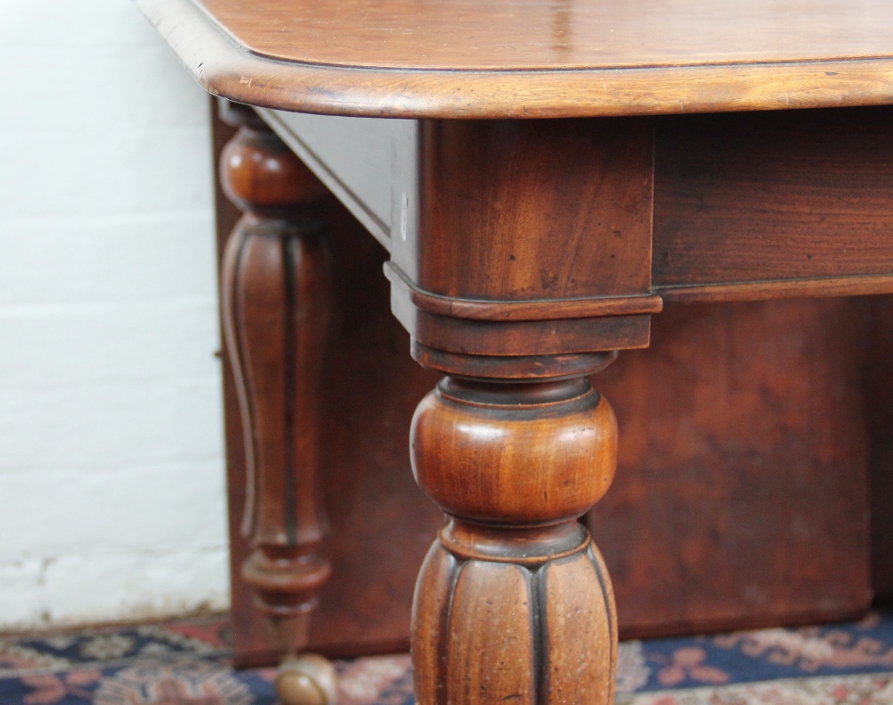 An early Victorian mahogany extending dining table, with three spare leaves, - Image 3 of 3