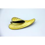 A Norwegian enamelled brooch by Arne Nordlie, the silver brooch enamelled in yellow and black,