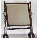 A late 19th century mahogany swivel toilet mirror, with rectangular plate,