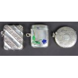 Three silver vesta cases, to include; a circular example with lightly hammered finish J H Hillcox,