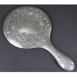 A silver backed hand mirror Walker and Hall, Sheffield 1915, of typical form,