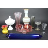 Nine pieces of glass to include; a hollow stem champagne, a blue glass rolling pin,