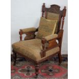 A Victorian carved walnut salon chair with stylish pale green upholstery decorated with elephants,