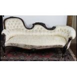 A Victorian carved and stained walnut chaise long,