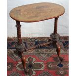 A Victorian inlaid walnut oval stretcher table, on carved scroll feet, fitted casters,