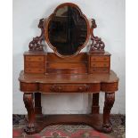 A Victorian mahogany serpentine dressing table, with oval plate above six drawers and lidded box,