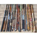 An assortment of vintage and modern fishing rods and rod sections (qty)