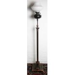 A copper fluted Corinthian column standard lamp, on square base and claw and ball feet,