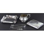 A collection of silver to include; a silver ash tray 10.5cm wide, a silver cigarette case 8.