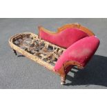 A late Victorian carved walnut chaise long frame,