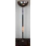 An Art Deco style chrome uplighter standard lamp, on a stepped base,