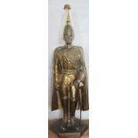 A cast brass Life Guard fire side companion, with poker plume on hexagonal base,