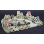 A Royal Doulton collectors model of Old Millers Brook, six buildings on a larger modelled base,