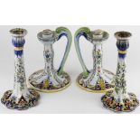 A pair of Mosanic French Faience candlesticks, florally decorated, with ogee panels to the base, 24.