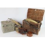 A vintage wicker angling tackle box; with a long landing net; other nets,