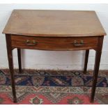A George III mahogany bow front side table, with drawer on tapered legs,