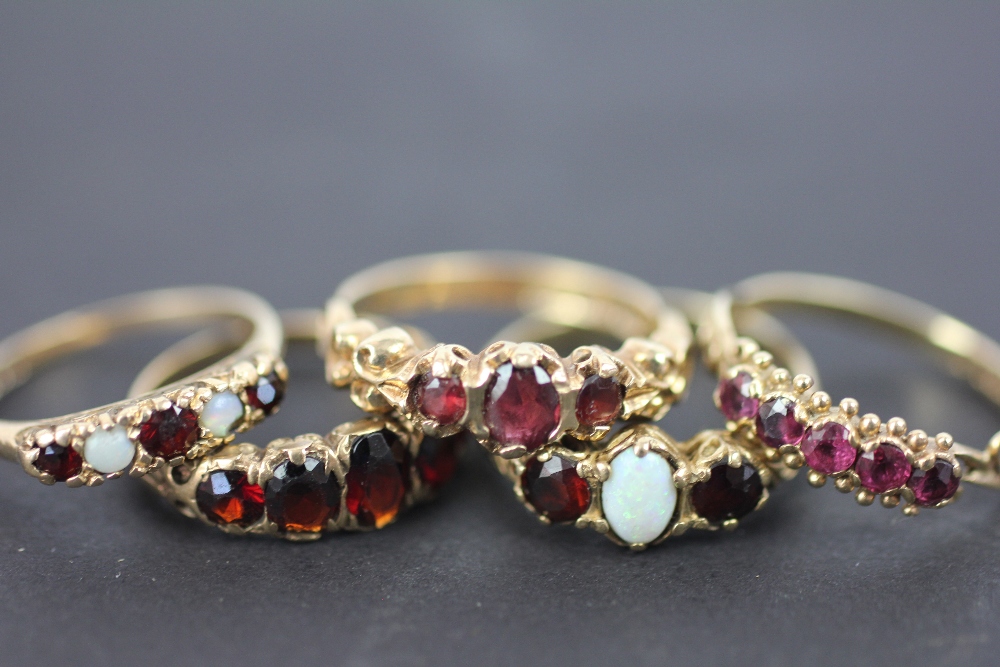 Six rings, to include; three garnet rings set in 9ct yellow gold, - Image 2 of 2