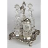 A late Victorian silver and cut glass cruet set, with two oil jars and stoppers, pepper and mustard,