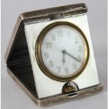 A George VI folding silver travelling time piece, eight day, with Arabic dial signed Drew & Sons,