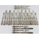 A set of twelve pairs of plated dessert knives and forks,