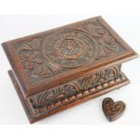 A George V carved oak love token box, carved 'E M Davies 1924' to the lid, 14.5cm high, 30.