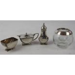 An Art Deco silver condiment set comprising open salt, pepper and covered mustard pot with spoon,