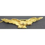 A 9ct yellow gold brooch in the form of an eagle, Edinburgh 1941, with attached safety chain,