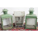 A pair of green painted cast iron lamps, of tapering form,