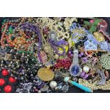 An assortment of decorative costume jewellery, to included brooches,