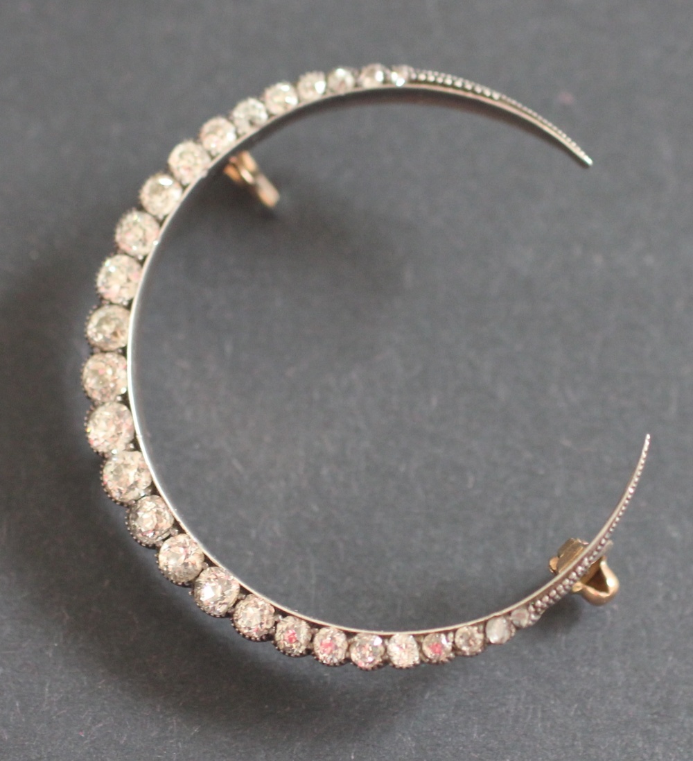 A Victorian diamond set crescent brooch, designed as twenty seven graduated, - Image 2 of 2