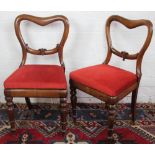 A set of six William IV carved rosewood dining chairs,