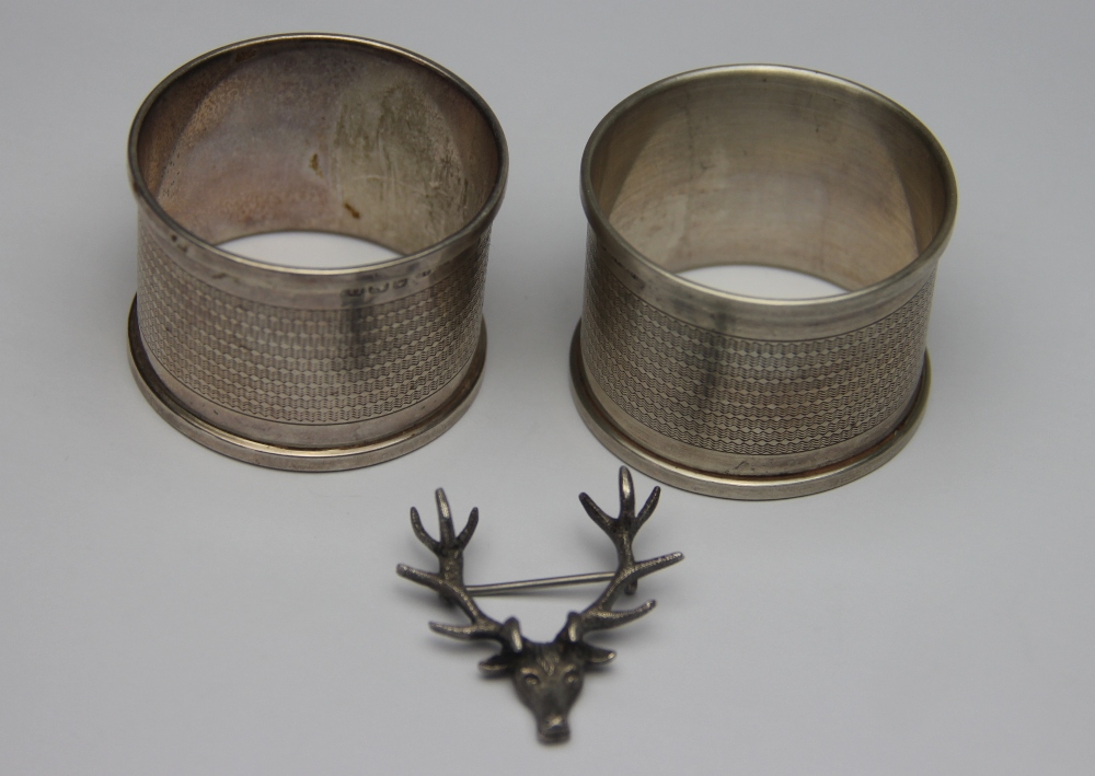 A pair of silver napkin rings, Henry Griffith & Sons Ltd, Birmingham 1938, initialled,