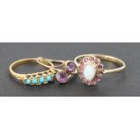 Three rings, to include; an opal and ruby oval cluster ring set in 9ct yellow gold,